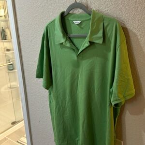 Calvin Klein polo shirt in size XL.